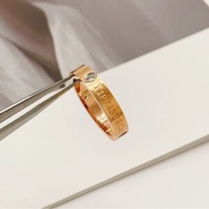 Tiffany & Co. Gold Ring with Diamond Accent